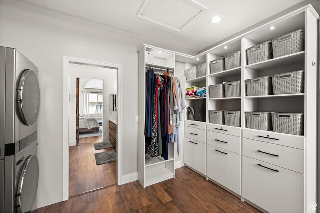 322 Flour Mill Dr, Kaysville, UT 84037 - spacious closet with attic access, dark wood-style floors, and stacked washing maching and dryer