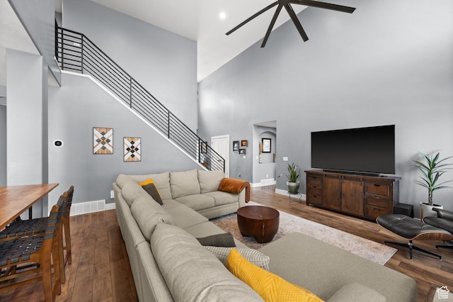 322 Flour Mill Dr, Kaysville, UT 84037 - living room with stairway, wood finished floors, ceiling fan, a towering ceiling, and baseboards