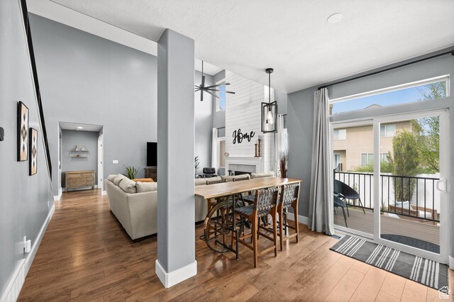 322 Flour Mill Dr, Kaysville, UT 84037 - dining area with wood finished floors, a ceiling fan, and baseboards