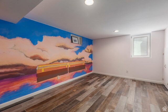 interior space featuring baseboards, wood finished floors, and recessed lighting