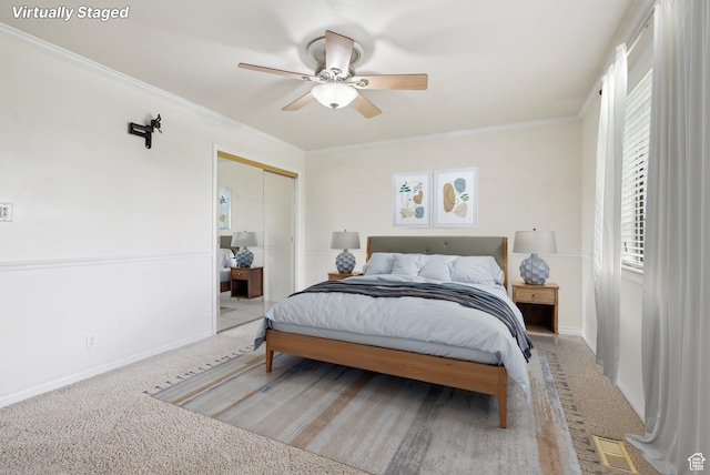 107 Country Club Dr, Stansbury Park, UT 84074 - bedroom with a ceiling fan, crown molding, carpet floors, baseboards, and a closet