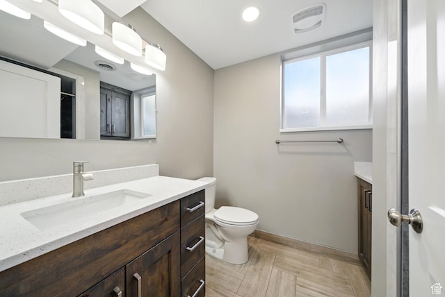 107 Country Club Dr, Stansbury Park, UT 84074 - bathroom featuring vanity, baseboards, and toilet