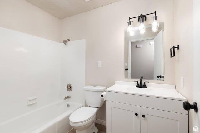 bathroom with toilet, vanity, and shower / tub combination