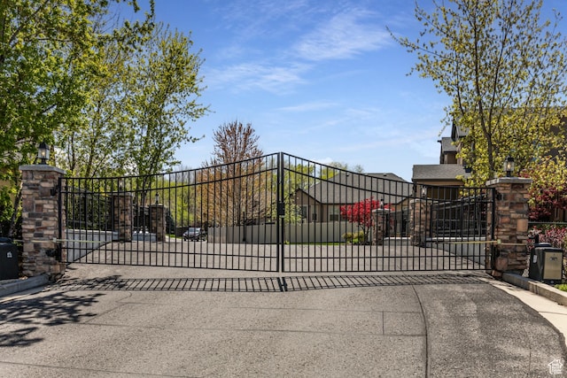 6061 S Bridges Ln, Murray, UT 84121 - view of gate featuring fence