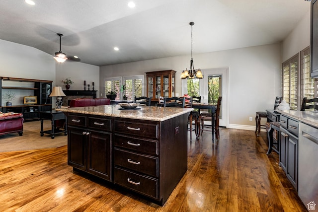6061 S Bridges Ln, Murray, UT 84121 - kitchen featuring dishwasher, vaulted ceiling, dark wood-style flooring, and plenty of natural light