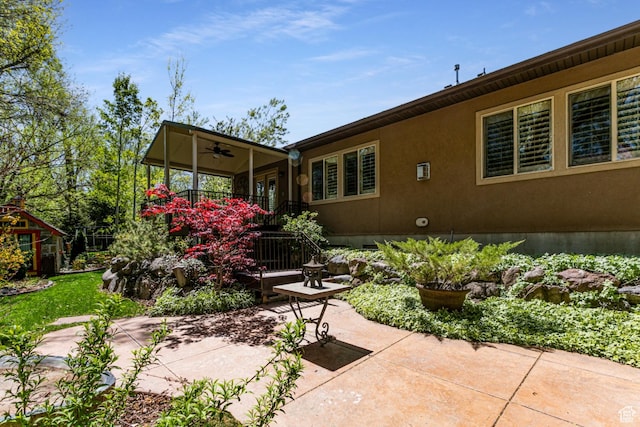 6061 S Bridges Ln, Murray, UT 84121 - rear view of house with a ceiling fan and a patio