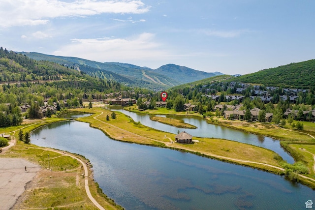 exterior space featuring a water and mountain view