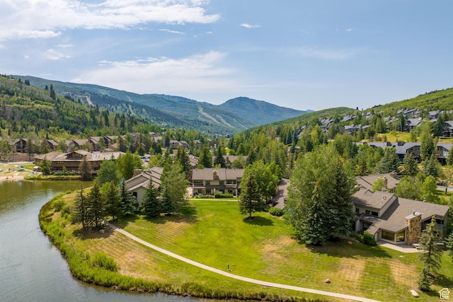 aerial view featuring a water and mountain view and a residential view