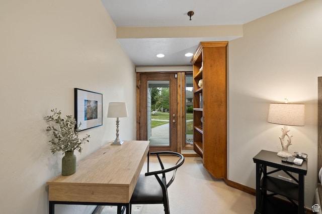 doorway to outside featuring baseboards