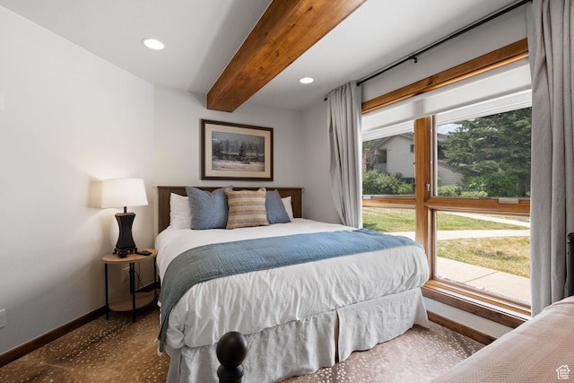 bedroom featuring baseboards, beamed ceiling, and recessed lighting