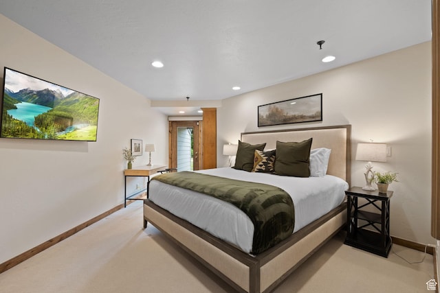 bedroom featuring recessed lighting, baseboards, and light colored carpet