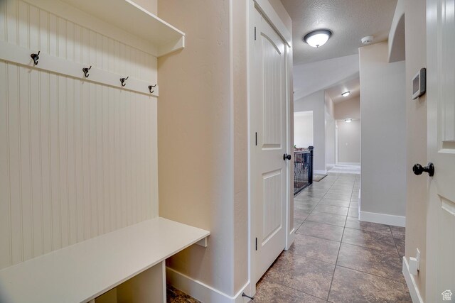 2520 S 260 E, Heber City, UT 84032 - mudroom featuring vaulted ceiling, tile patterned flooring, and baseboards