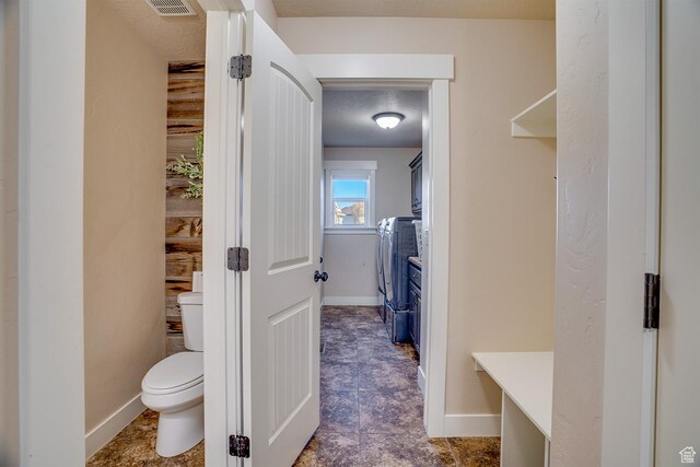 2520 S 260 E, Heber City, UT 84032 - bathroom with independent washer and dryer, visible vents, toilet, and baseboards