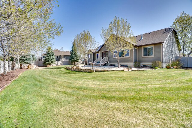 2520 S 260 E, Heber City, UT 84032 - rear view of property with a shingled roof, a fenced backyard, and a yard
