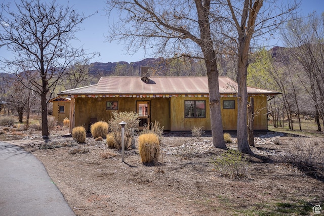 674 E Dragon Fly Trl, Moab, UT 84532 - view of front of house with a mountain view and metal roof