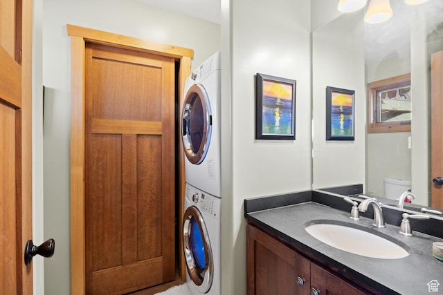 674 E Dragon Fly Trl, Moab, UT 84532 - bathroom with vanity and stacked washer and clothes dryer