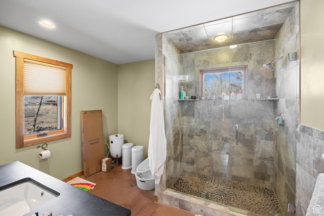 674 E Dragon Fly Trl, Moab, UT 84532 - bathroom with recessed lighting, baseboards, toilet, and a stall shower