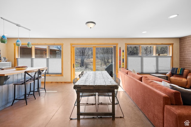 674 E Dragon Fly Trl, Moab, UT 84532 - dining space featuring baseboards, a healthy amount of sunlight, finished concrete floors, and recessed lighting