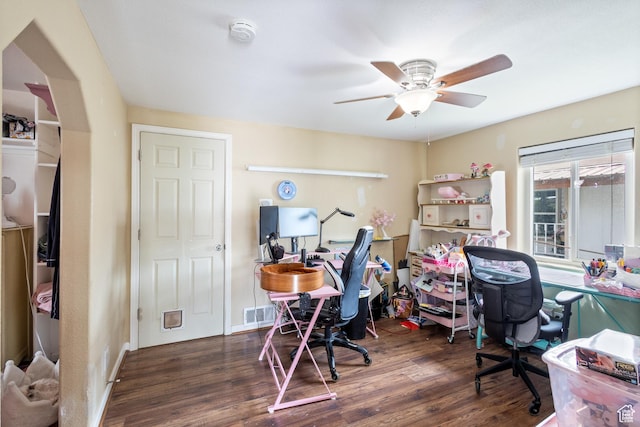 home office featuring wood finished floors, baseboards, and ceiling fan