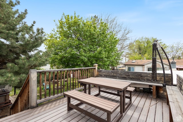 wooden deck with outdoor dining space