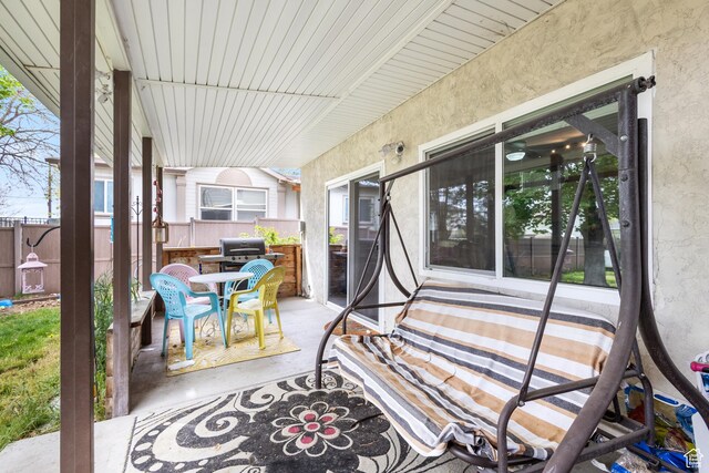 view of patio featuring fence