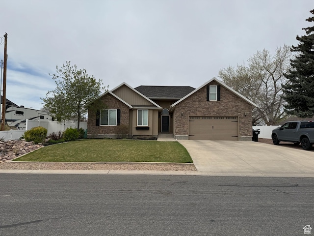 view of front of home with fence, a front lawn, concrete driveway, an attached garage, and brick siding