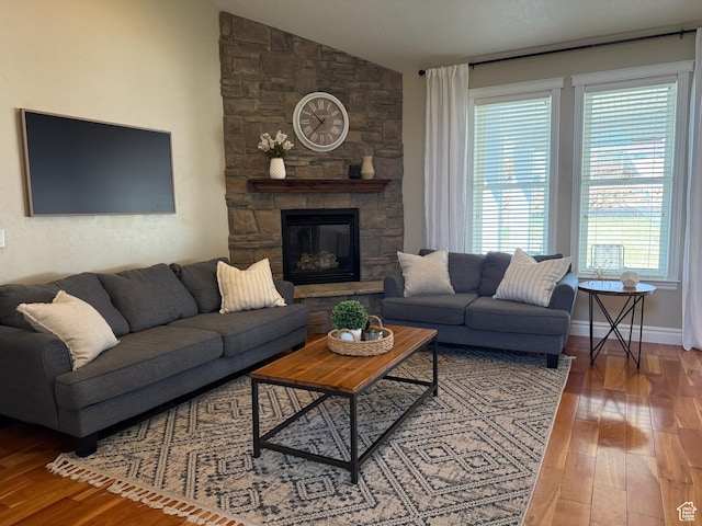 175 N 900 W, Roosevelt, UT 84066 - living room with vaulted ceiling, wood finished floors, and a stone fireplace