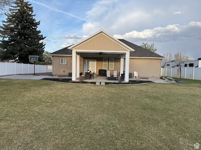 175 N 900 W, Roosevelt, UT 84066 - back of property featuring a patio area, a lawn, a ceiling fan, a fenced backyard, and an outdoor living space with a fire pit