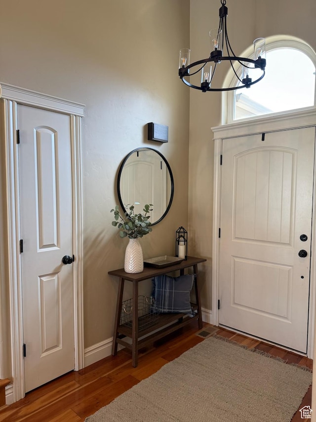 175 N 900 W, Roosevelt, UT 84066 - entrance foyer with a chandelier, wood finished floors, and baseboards