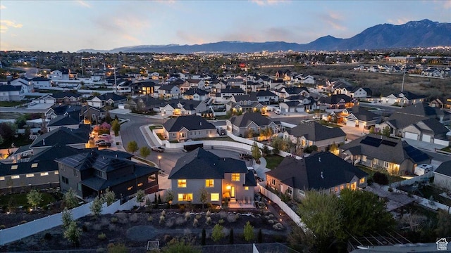 aerial view at dusk with a residential view and a mountain view
