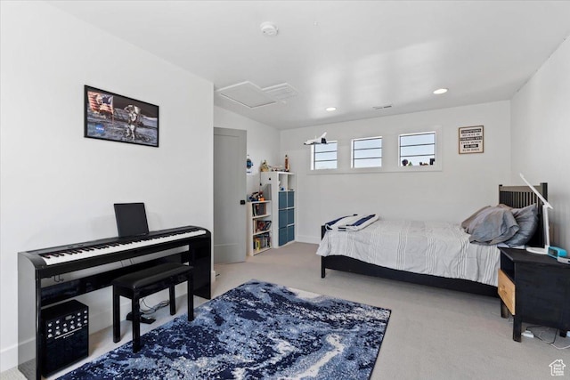 carpeted bedroom featuring attic access, baseboards, and recessed lighting