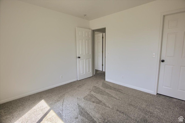 691 N Gramercy Ave, Ogden, UT 84404 - unfurnished bedroom with baseboards and carpet flooring