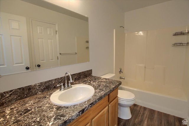 691 N Gramercy Ave, Ogden, UT 84404 - bathroom featuring wood finished floors, vanity, washtub / shower combination, and toilet