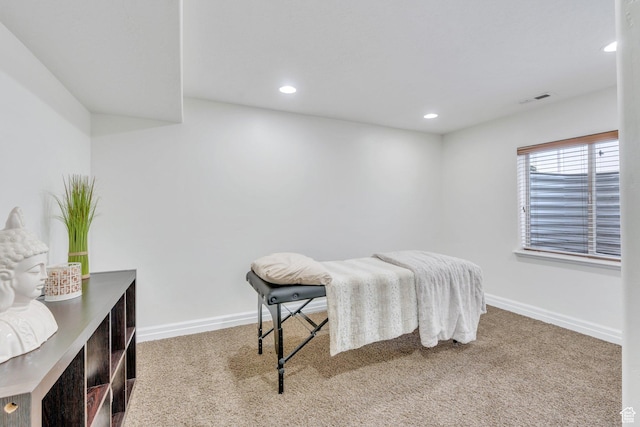 bedroom with visible vents, carpet flooring, and baseboards