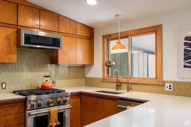 2779 S Connor St S, Millcreek, UT 84109 - kitchen with brown cabinets, stainless steel appliances, light countertops, a sink, and decorative backsplash