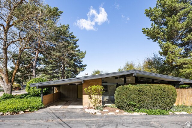 2779 S Connor St S, Millcreek, UT 84109 - view of parking featuring aphalt driveway and an attached carport