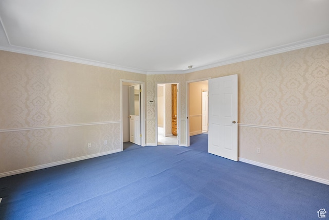 unfurnished bedroom featuring wallpapered walls, dark carpet, and ornamental molding