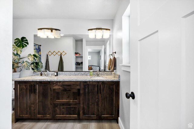 281 N 840 E, Hyrum, UT 84319 - full bath featuring wood finished floors, a sink, and double vanity