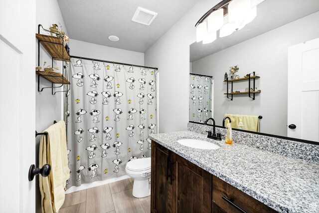 281 N 840 E, Hyrum, UT 84319 - full bathroom with visible vents, vanity, a shower with shower curtain, and toilet