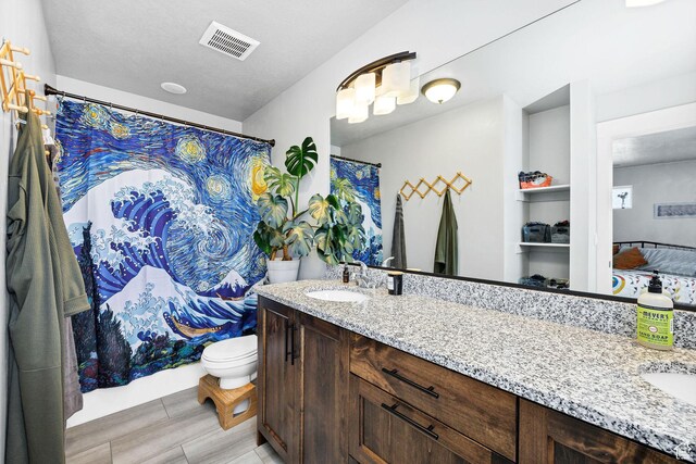 281 N 840 E, Hyrum, UT 84319 - full bathroom featuring visible vents, toilet, and vanity