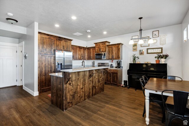 281 N 840 E, Hyrum, UT 84319 - kitchen featuring dark wood finished floors, appliances with stainless steel finishes, a sink, and recessed lighting