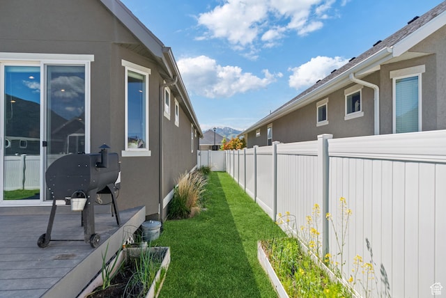 2212 W Autumn Dr S, Mapleton, UT 84664 - view of side of home with a deck with mountain view and stucco siding