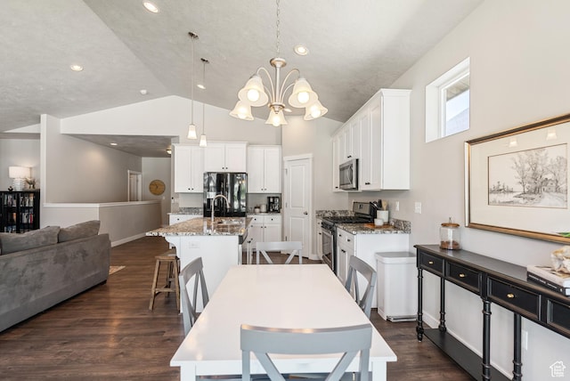 2212 W Autumn Dr S, Mapleton, UT 84664 - dining room featuring a chandelier, dark wood-type flooring, recessed lighting, and high vaulted ceiling