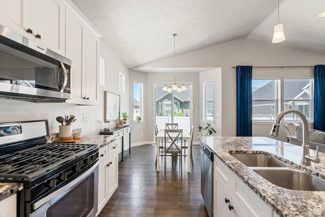 2212 W Autumn Dr S, Mapleton, UT 84664 - kitchen with appliances with stainless steel finishes, a sink, vaulted ceiling, a chandelier, and dark wood-type flooring