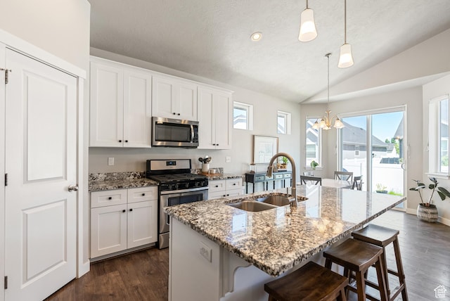 2212 W Autumn Dr S, Mapleton, UT 84664 - kitchen with appliances with stainless steel finishes, a sink, a chandelier, lofted ceiling, and dark wood-type flooring