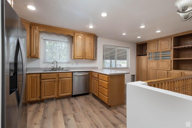 9128 S Terri Lynn Dr Unit 147, Sandy, UT 84094 - kitchen featuring stainless steel appliances, a sink, a peninsula, recessed lighting, and plenty of natural light