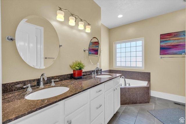 458 E Homespun Cir, Leeds, UT 84746 - bathroom featuring tile patterned floors, a garden tub, visible vents, and a sink