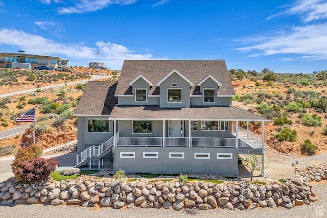 458 E Homespun Cir, Leeds, UT 84746 - view of front of property with stucco siding, a porch, stairs, and a shingled roof