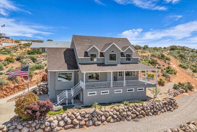 458 E Homespun Cir, Leeds, UT 84746 - view of front of property featuring a porch, roof with shingles, stairway, and stucco siding