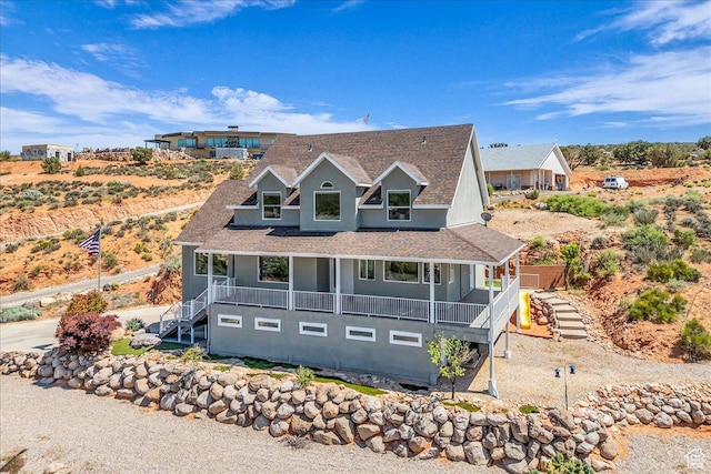 458 E Homespun Cir, Leeds, UT 84746 - view of front of home featuring stucco siding, stairs, a shingled roof, and covered porch
